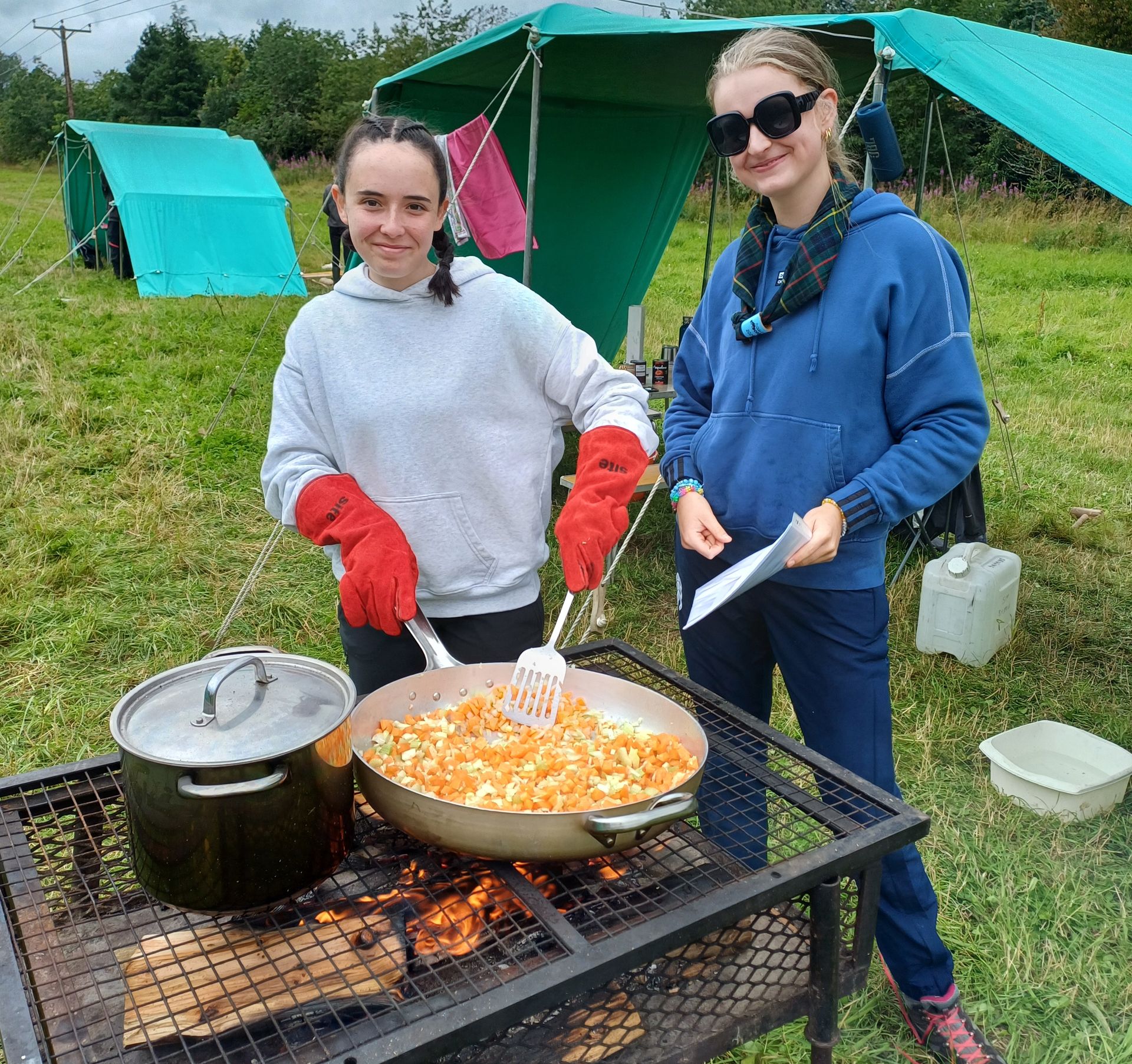 Wildfire Explorers cooking on an altar fire with new frying pan