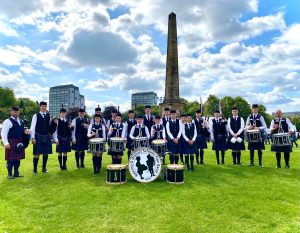 The Pile Band in full regalia with instruments