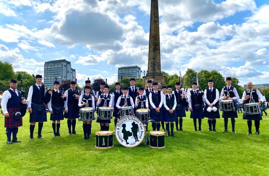 The Pile Band in full regalia with instruments