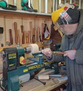 Pentlands Men's Shed member using lathe