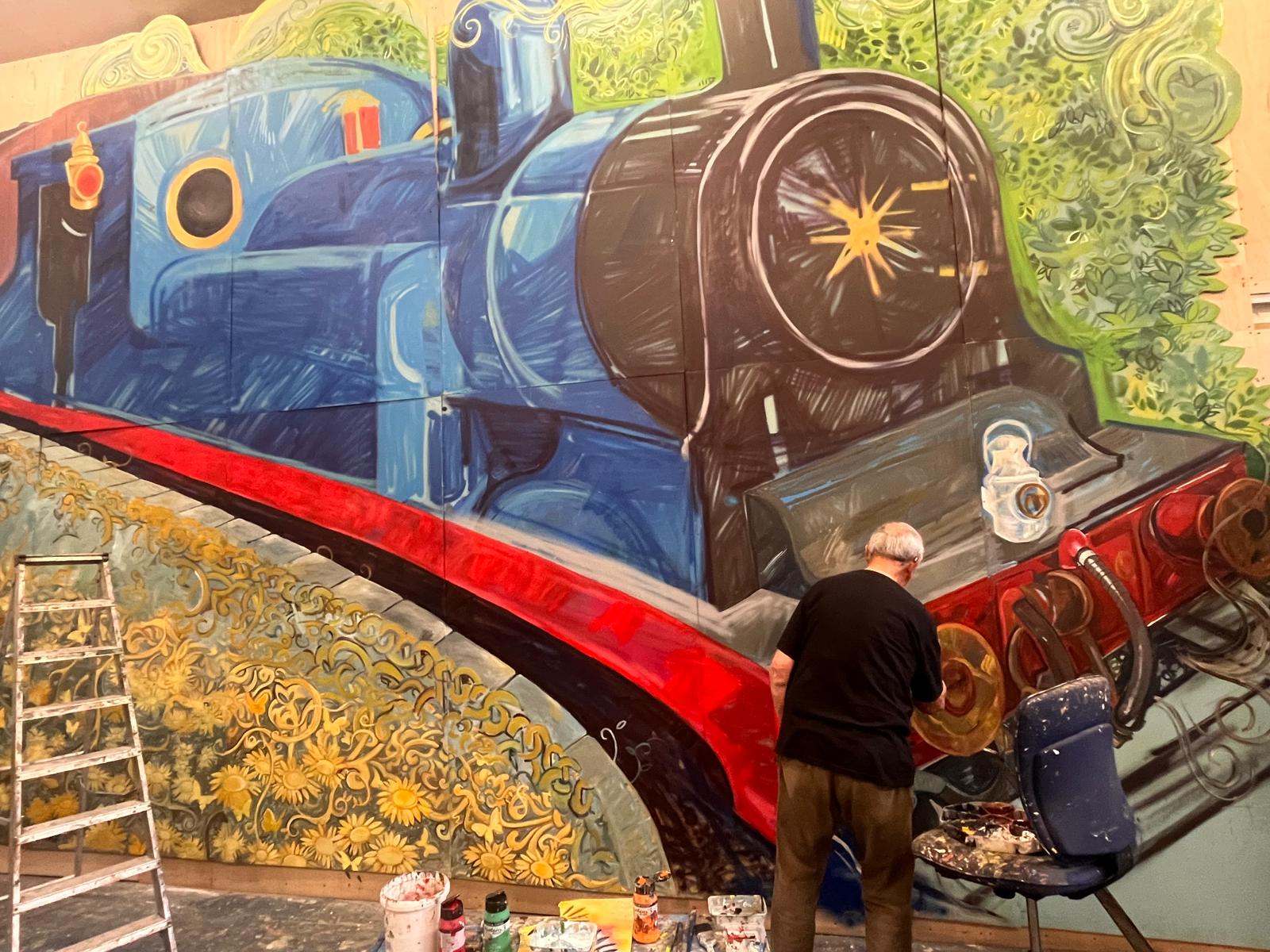 A photo of a train being painted for the tunnel